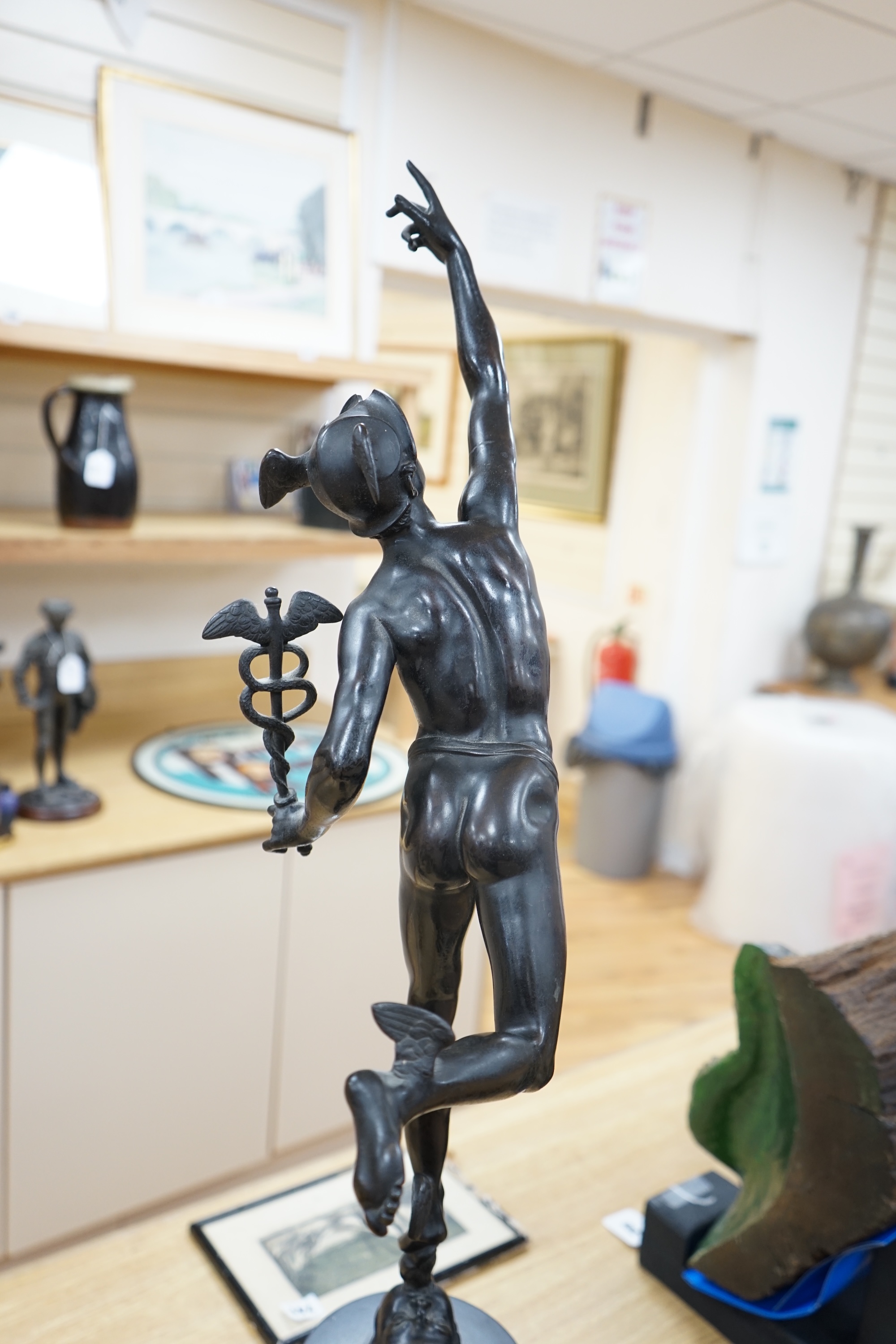 A late 19th / early 20th century Grand Tour style bronze study of Mercury raised on a circular column base, 87cm high. Condition - small chips to black slate plinth otherwise in good condition